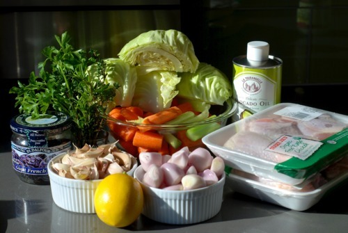 Assembled ingredients on a kitchen countertop for the paleo chicken-in-a-pot recipe.