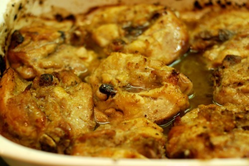 Caramelized chicken in a baking dish for the Whole30 roast chicken recipe. 