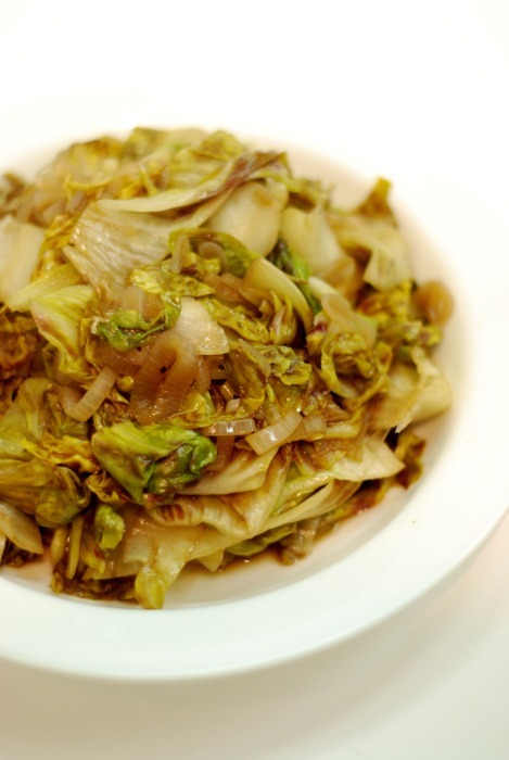 A close up of a bowl that contains wilted and stir fried Castelfranco radicchio. The dish is Whole30 and paleo.