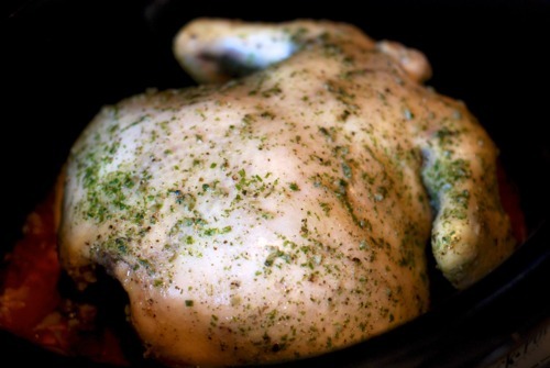 A shot of Slow Cooker Roast Chicken and Gravy ready to be taken out of a slow cooker