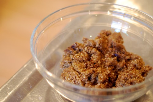 A bowl filled with pureed nuts and prunes.