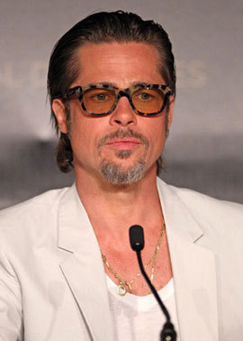 It looks like Brad Pitt is wearing a Truman Capote Halloween costume, but doing it wrong.
(Photo c/o my friend Kristen)