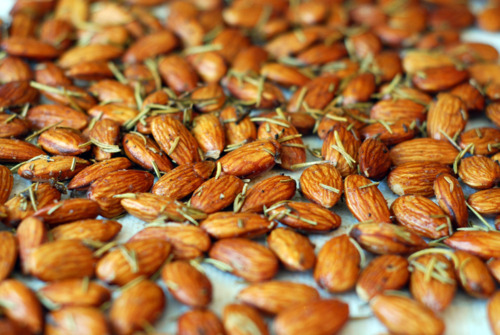 Roasted rosemary almonds cooling off on paper towels.