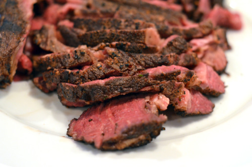 Slices of sous vide cowboy chop on a plate.