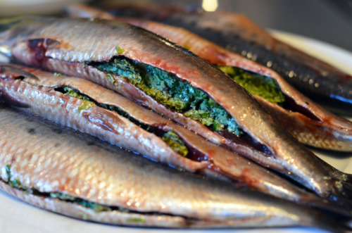 The bellies of sardines stuffed with the herb-butter blend.