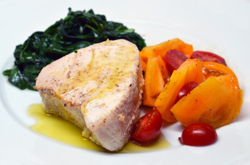 Softcore tuna, A.K.A., tuna braised in olive oil, on a plate with vegetables on the side.
