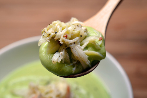 A spoonful of =chilled avocado cream soup with Dungeness crab.
