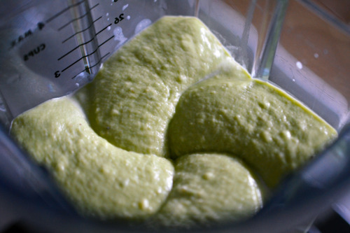 The avocado cream soup being blended in a blender.