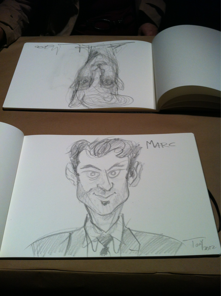 At the Moleskine Portraits event, they had a drawing duel. This is my new friend Marc, the upside down drawing is me.