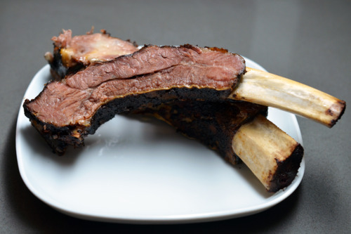 Slow roasted ribs cut on a plate.