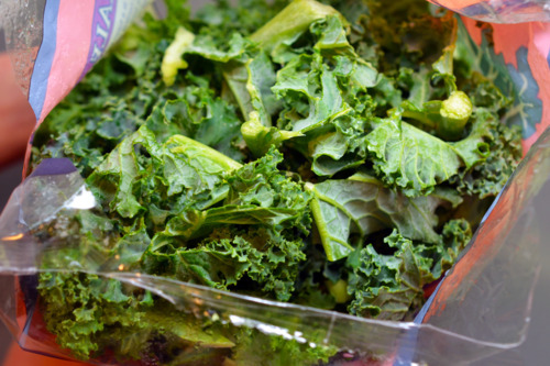 An opened bag of kale that is washed and pre-cut.