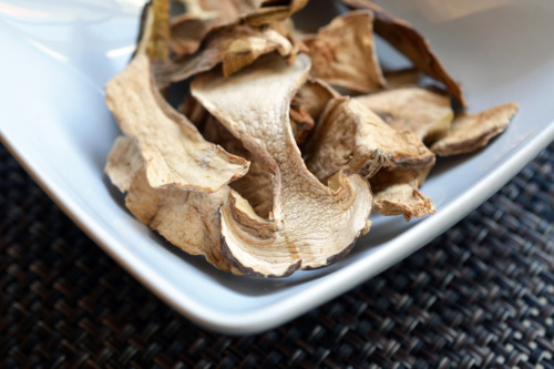 Dried porcini mushrooms in a bowl.