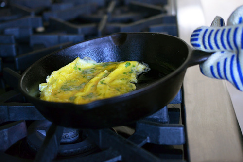 Cooking the omelet in Julia Child's rolled style.