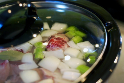 A close up of a slow cooker with the lid on.