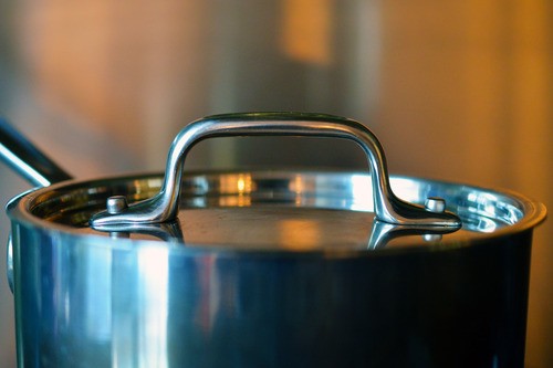 A saucepan is covered with a lid.