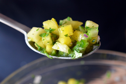 A spoonful of spicy pineapple salsa.