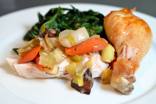 A plate of the easiest roast chicken ever with vegetables.