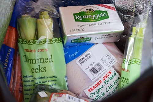 A closeup of a Trader Joe's grocery haul for the easiest roast chicken ever.