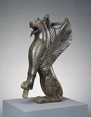 Winged Feline Tartessian, Spain, 700 - 575 B.C. This winged feline originally served as the front leg of a wooden chair or throne. Felines were popular in the art of many Mediterranean and Near Eastern cultures. Certain stylistic features of this...