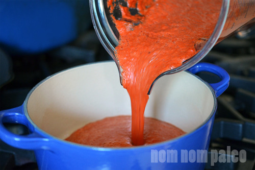 Pouring the Paleo Sriracha into a saucepan.