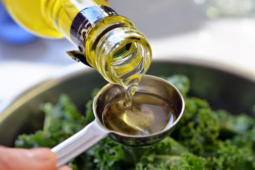 Measure out the avocado oil for the baked kale chips.